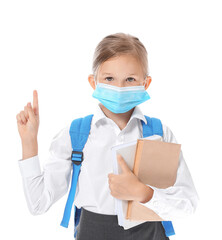 Little schoolgirl in medical mask and with raised index finger on white background. Coronavirus epidemic