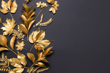 Different golden leaves on dark background