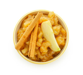 Bowl with sweet apple jam and cinnamon on white background