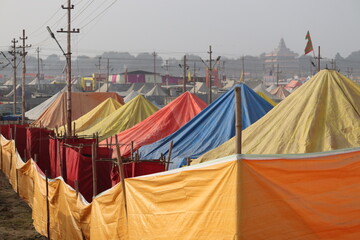 Allahabad, Uttar Pradesh India- February 09 2021: Colorful waterproof tents placed next to each other at the holy refugee camp for pilgrims.