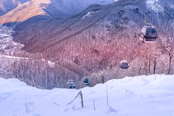 Lift cabins in a mountain ski resort  snowy slope  in a  winter