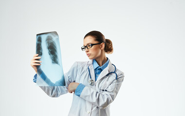 Woman doctor at work with x-ray close-up cropped view