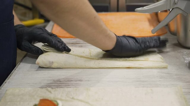 Video of the process of wrapping shawarma in classic lavash