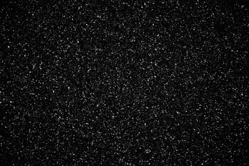 Falling realistic natural snowflakes on a black backgraund