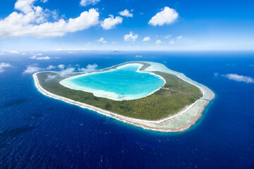 Aerial view of the heart-shaped Tupai atoll in French Polynesia