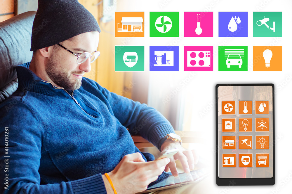 Poster smart home. man sits in a chair and controls all functions of house from mobile phone. control of he