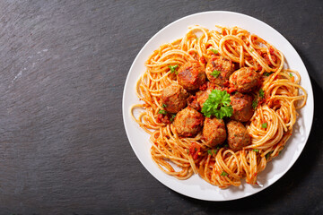 plate of pasta with meatballs, top view
