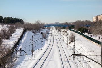 Snowy train tracks in Coslada on a cold winter morning.
