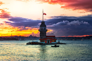 Fiery sunset over Bosphorus with famous Maiden's Tower (Kiz Kulesi) also known as Leander's Tower,...