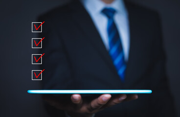 Checklist concept, Businessman checking mark on the check boxes with marker red, copy space