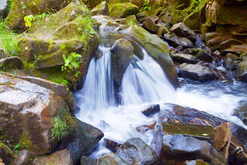 Small waterfall on mountain river long exposure