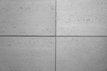 betonowa nowoczesna ściana pokryta szarymi betonowymi płytkami w stylu modern lub loft - obrazy, fototapety, plakaty