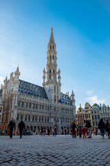View of the Grand Place, Brussels, in a winter season on a beautiful sunny day. Tourists are...