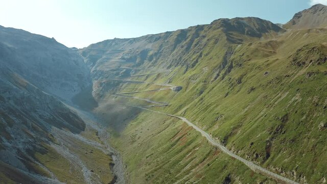 Wide aerial shot of Stelvio Pass with hairpin corners. Highest paved mountain road in the Eastern Apls.