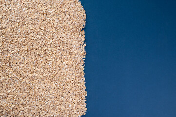 oatmeal sprinkled on half a sheet, with space for text