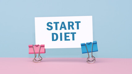 Start Diet - concept of text on business card on pink and blue background