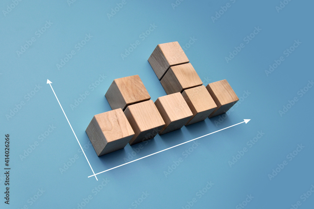Poster wooden cubes in the form of a non-uniform graph. not a stable increase in anything