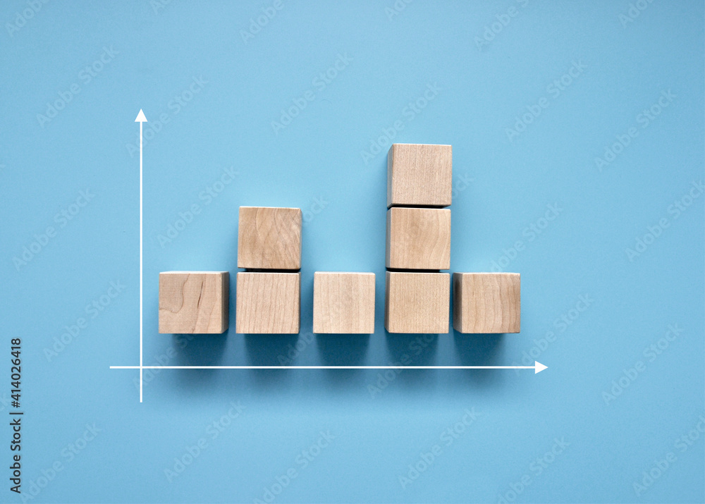 Poster wooden cubes in the form of a non-uniform graph. not a stable increase in anything