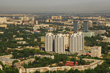 Naklejka na ściany i meble Almaty, Kazakhstan - 06.18.2009 : Residential buildings and commercial buildings along the main streets of the city. View from the helicopter.
