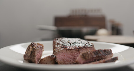new york steak on white plate