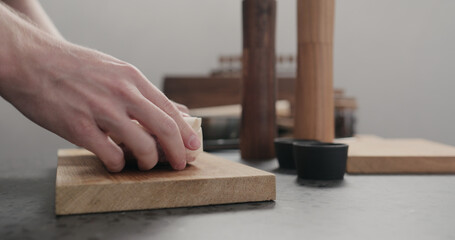 man unwrap new york steak on countertop