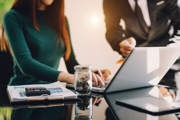  Business team meeting present.professional investor working with  Finance managers task. with laptop smart phone and digital tablet in morning light.