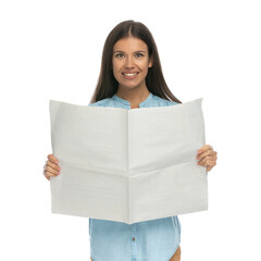 beautiful casual woman reading the newspaper with a smile