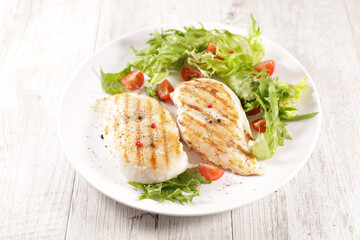grilled chicken with lettuce on plate