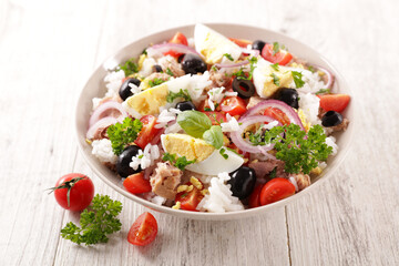 mixed rice salad with egg, tomato, olive