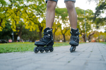 Man rollerskating outdoors on the street.