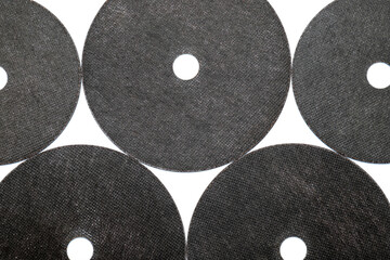 Abrasive black wheel, grinding disc , isolated on white background. Abrasive materials, discs, tools