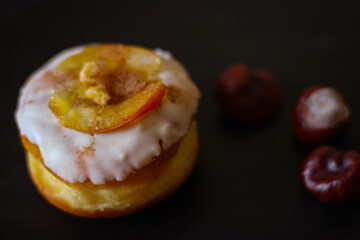 Delicious Donuts with apple and cinnamon on a black background