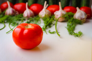 Good organic cucumbers and red tomatoes and garlic