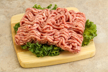 Raw pork minced meat over board