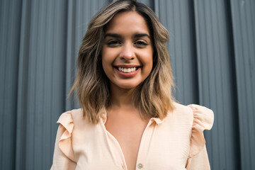 Portrait of young woman outdoors.