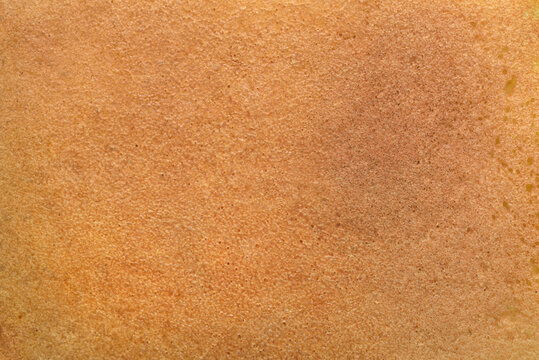 Outside crust surface of rye bread background or texture.