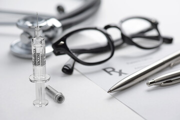 Influenza vaccine in prefilled syringe on the doctors table. 3D rendering.