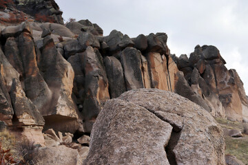Fototapeta na wymiar The rocky hill. Eroded rocks. Wind erosion. Nature landscape background.
