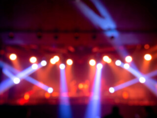 Fototapeta na wymiar Blurred stage light concert background.