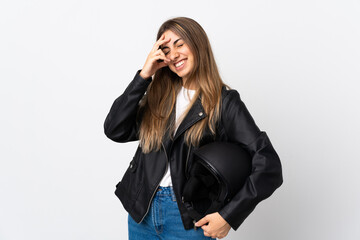 Young Woman holding a motorcycle helmet over isolated white background laughing