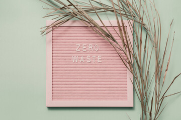 Zero waste white text on on a recycled paper background. Eco waste recycling concept