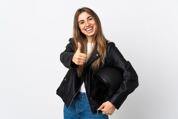 Young Woman holding a motorcycle helmet over isolated white background giving a thumbs up gesture