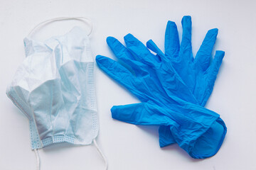 
medical gloves and mask on white background