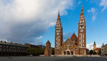 Fototapeta na wymiar Votive Church and Cathedral of Our Lady on main square of Szeged in autumn day, Hungary