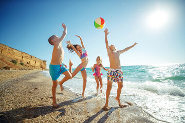 Cute kids having fun on the sandy beach in summer. High quality photo. - 414046059