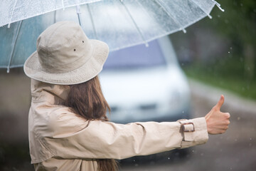 Hitchhiking girl on a road