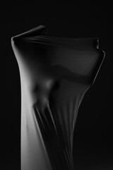 a girl posing in fabric on a black background