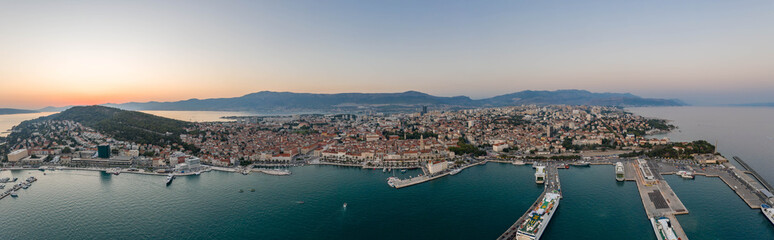 Fototapeta na wymiar Panoramic view of ferry port riva coastline by Diocletian Palace in Split old town in sunset