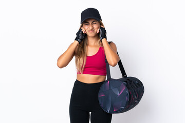 Young sport woman with sport bag over isolated white background frustrated and covering ears