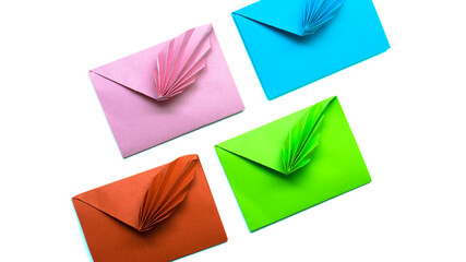 Red, pink and blue  paper envelopes  on white background isolated. 